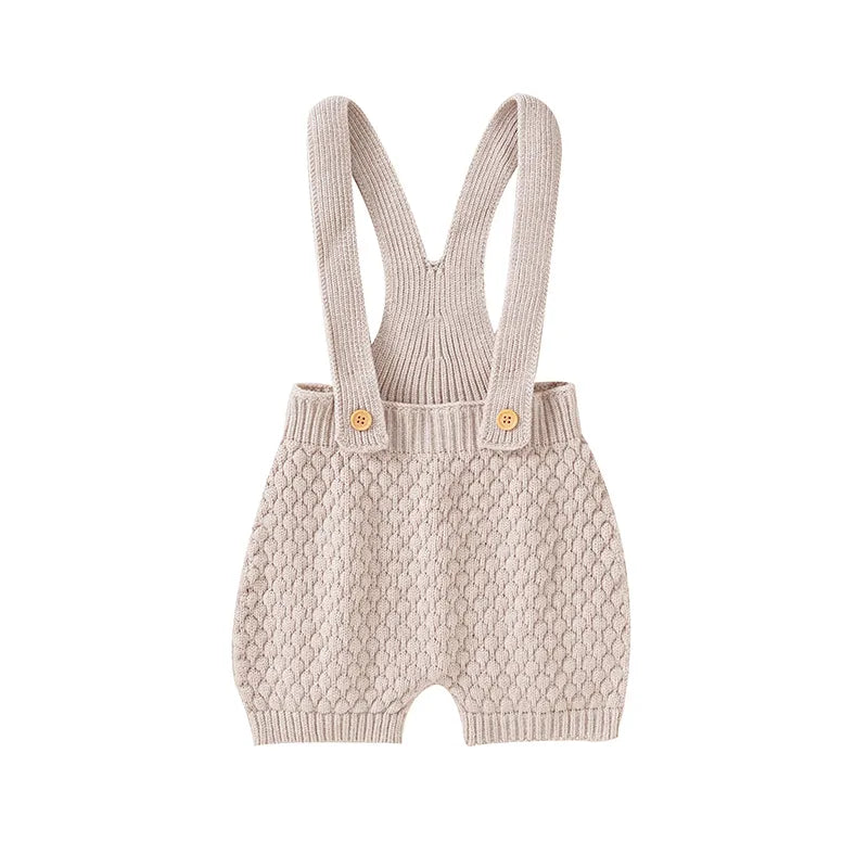 Unisex infant sunsuit, a cute baby fashion staple for spring and summer comfort.