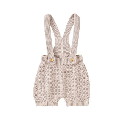Unisex infant sunsuit, a cute baby fashion staple for spring and summer comfort.