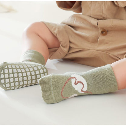 Unisex baby socks with cute cartoon animal design and anti-slip grip for safe play on floors