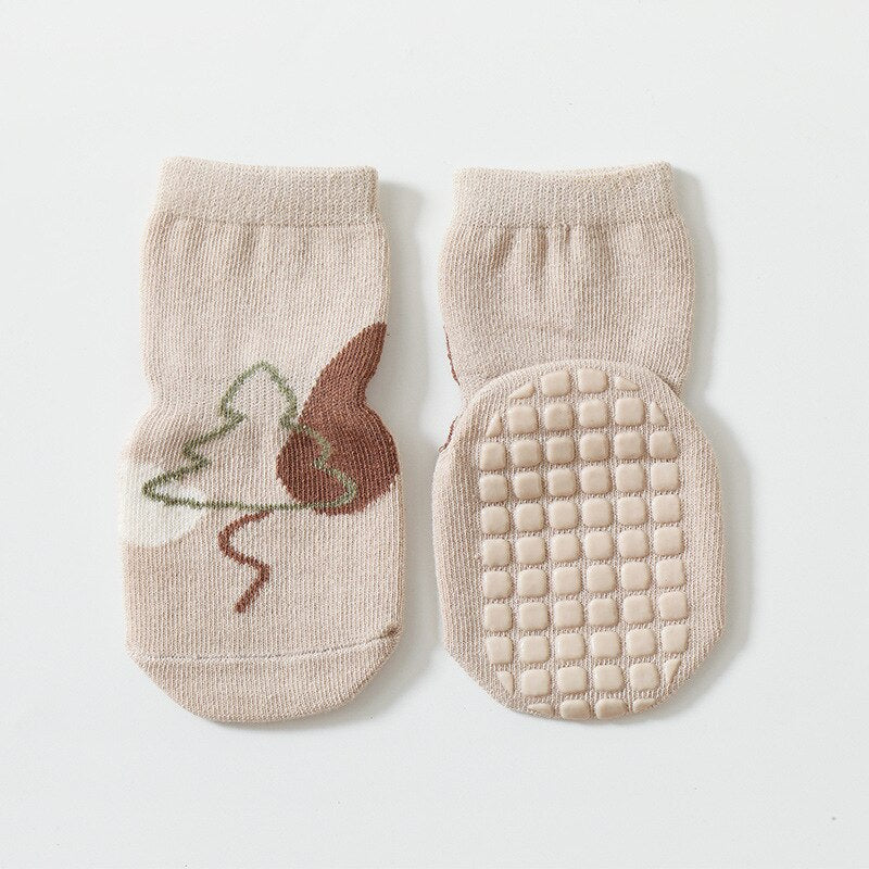 Anti-slip floor socks for kids, showcasing a cute cartoon animal design, ideal for infant apparel