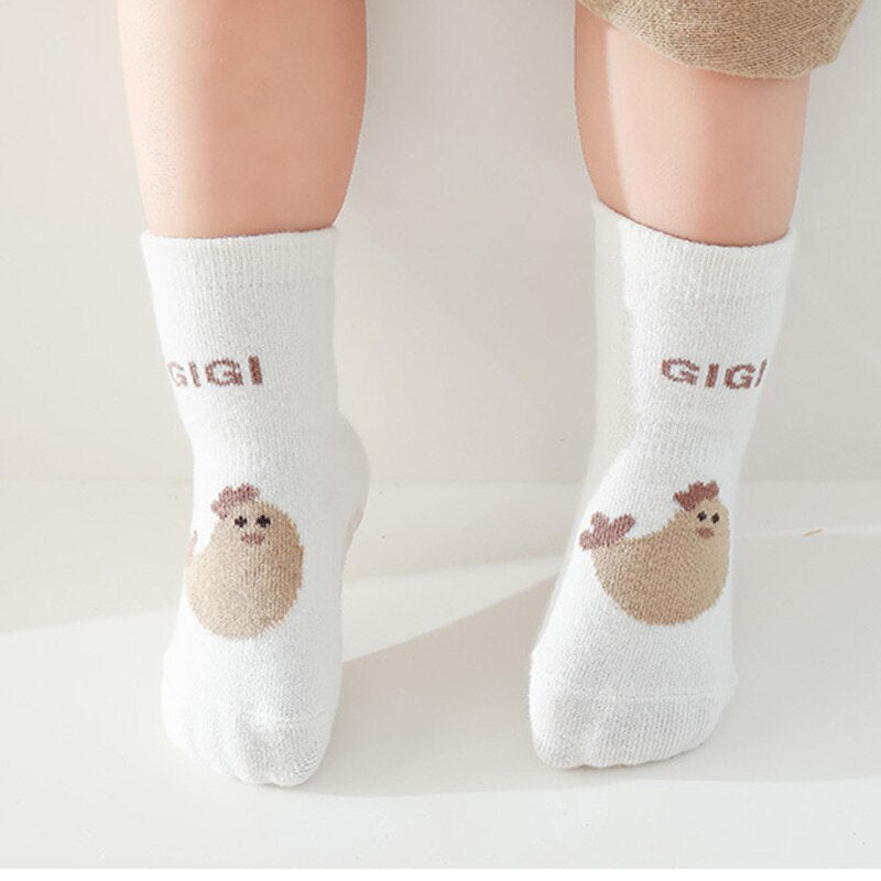 Unisex anti-slip baby socks with an endearing cartoon animal, ensuring secure footing for infants