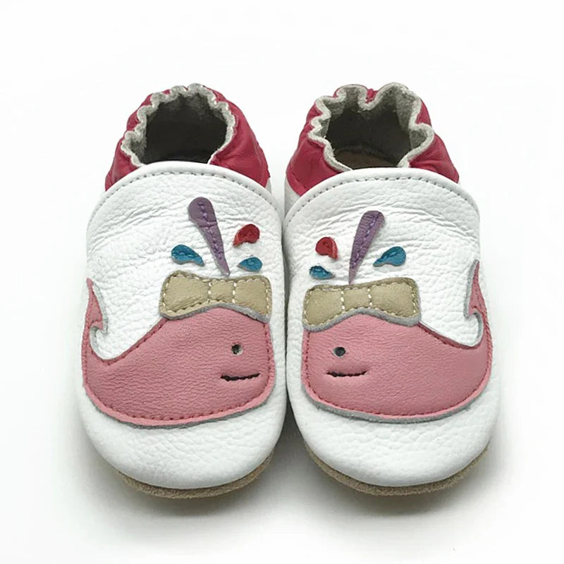 Front view of unisex baby leather booties, non-slip sole detail