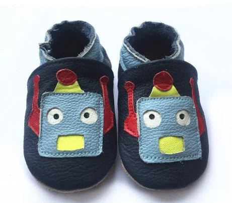 Unisex baby leather booties with adjustable strap, soft non-slip sole