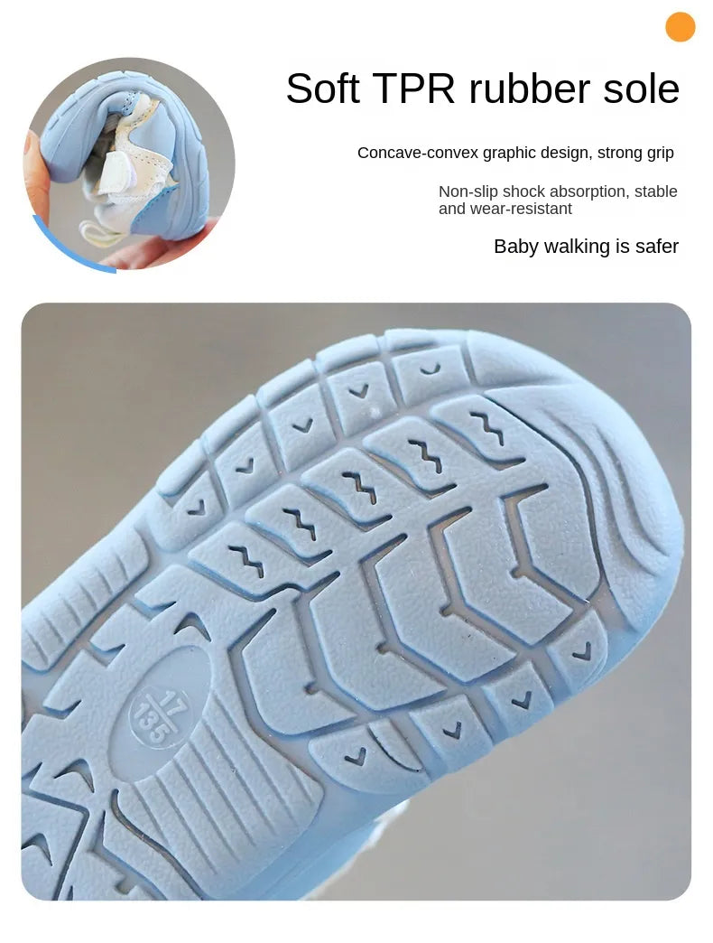 Baby's feet in comfortable, soft sole, anti-skid sneakers, ideal for indoor and outdoor play.