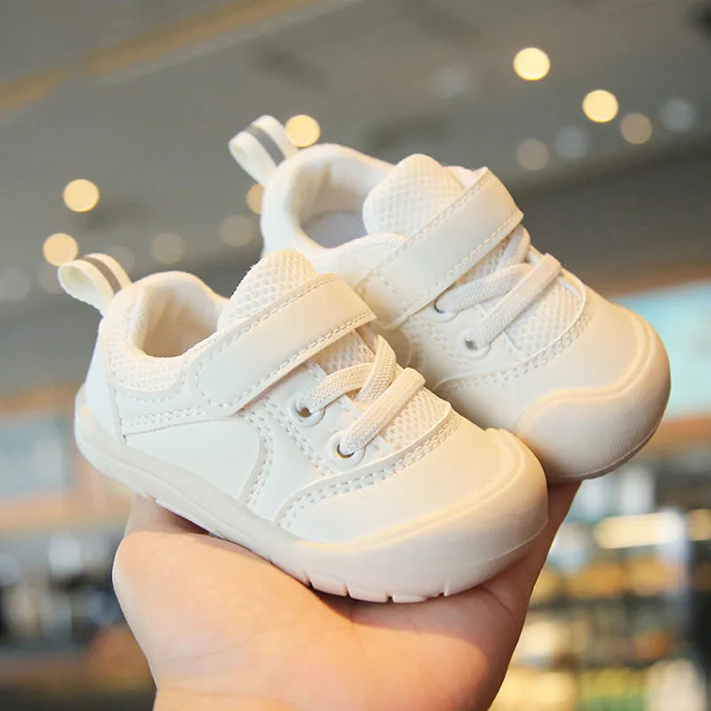 Close-up of a baby sneaker with a soft sole and anti-skid texture, ideal for toddlers learning to walk.
