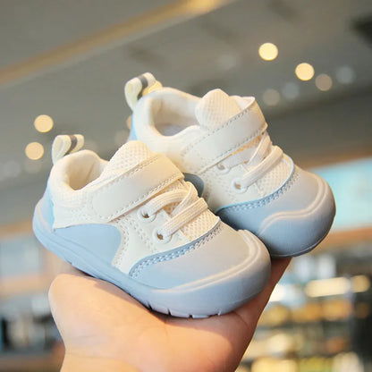 Pink soft sole baby sneakers, anti-skid for first steps, comfortable and stylish infant footwear.