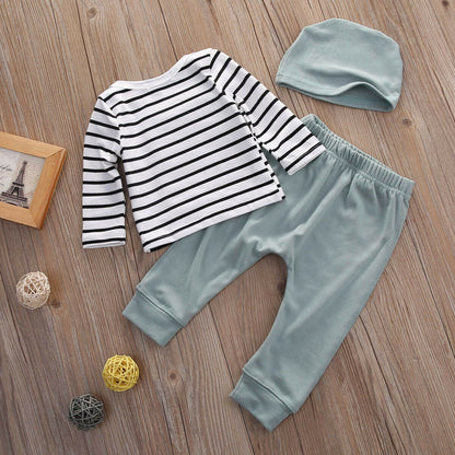 Close-up of soft cotton baby striped shirt and leggings set with matching hat for infants