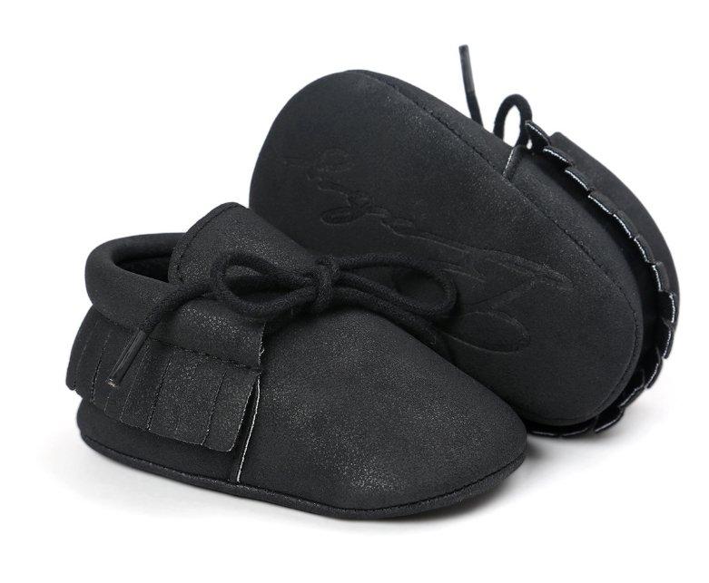 Side view of a unisex baby moccasin, highlighting the anti-slip sole and comfortable design.
