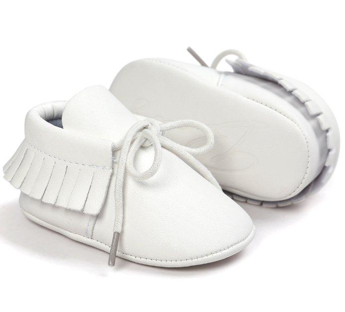 Collection of unisex baby tassel moccasins in various soft colors, anti-slip toddler footwear.