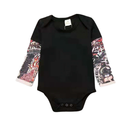 Punk rocker baby: full length view of a baby in a black tattoo sleeve cotton bodysuit