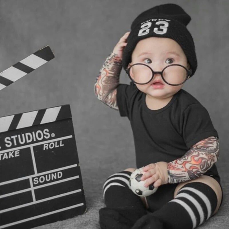 Detail of unique tattoo sleeve print on a comfortable unisex infant romper