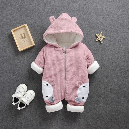Close-up of cute baby in a warm hooded animal romper, ideal for winter baby clothes