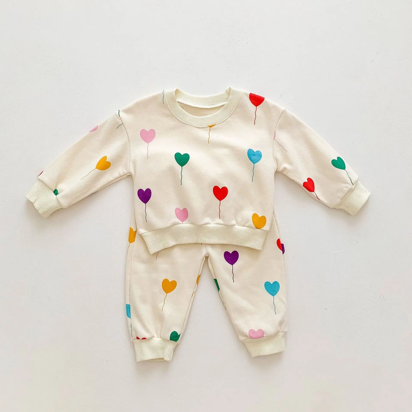 Complete baby tracksuit with heart pattern, super soft cotton for ultimate comfort and style.