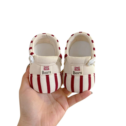Soft sole baby shoes in grey with non-slip grip, perfect for infants learning to walk