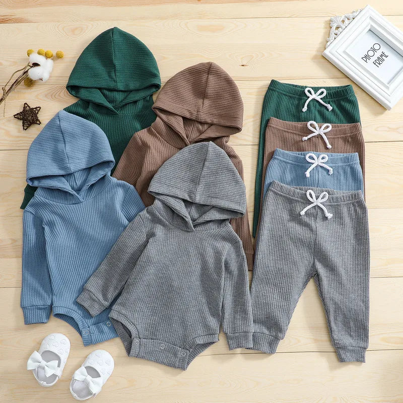 Close-up of soft fabric texture of unisex baby warm fall winter bodysuit and pants set