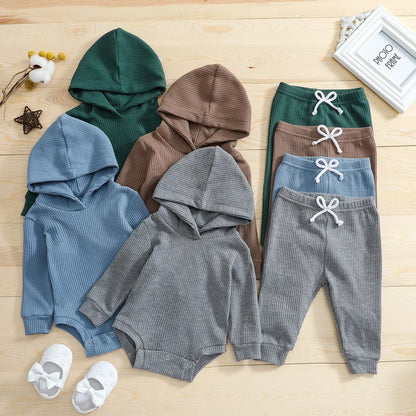 Close-up of soft fabric texture of unisex baby warm fall winter bodysuit and pants set