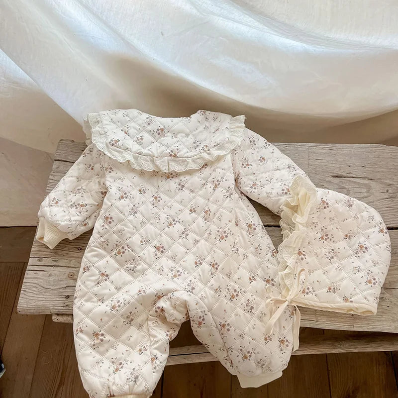 Baby unisex floral romper with warm fur lining and a comfortable winter baby hat.