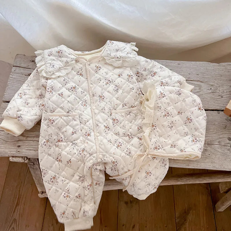 Winter baby clothes: floral romper, fur-lined for infants, plus a warm baby hat.