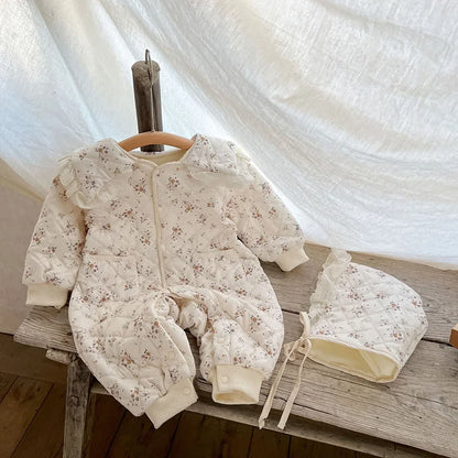 Infant floral romper with soft fur lining & hat, ideal for cold weather, unisex design.