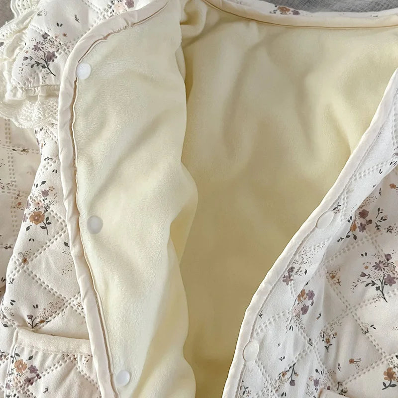 Unisex newborn floral romper, fur-lined, ensuring warmth with included baby hat.