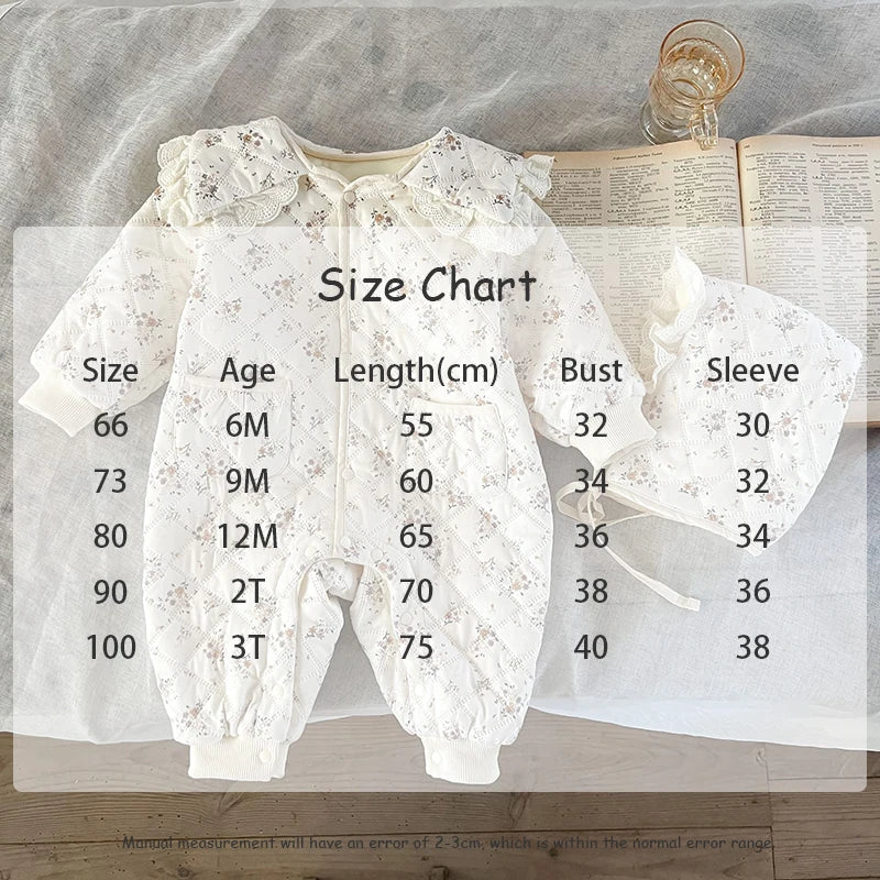 Adorable baby winter romper with floral pattern, warm fur lining, and coordinating hat.