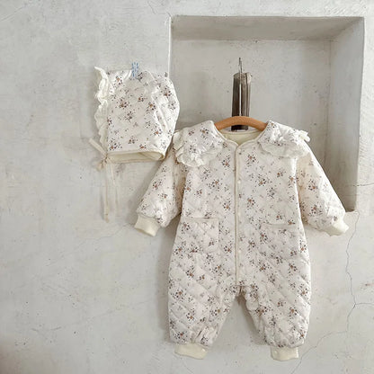 Soft baby winter floral romper, fur-lined for extra warmth, complete with a hat.