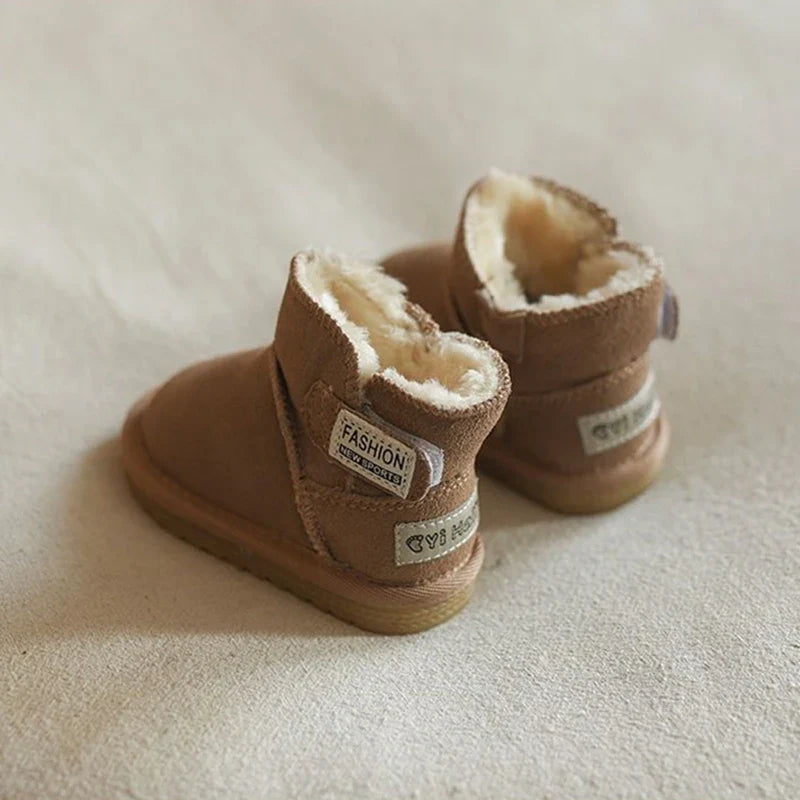 Unisex baby winter snow boots, khaki, styled on a wooden floor, highlighting fashion & function