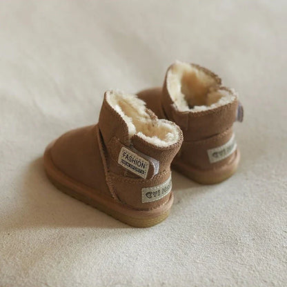 Unisex baby winter snow boots, khaki, styled on a wooden floor, highlighting fashion & function