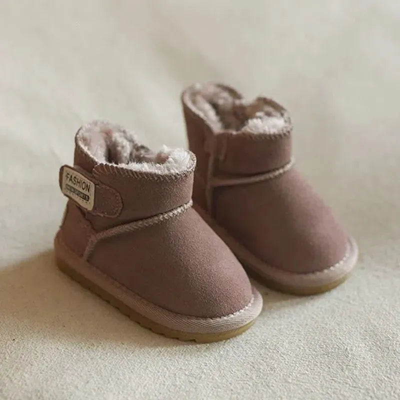 Close-up of the zip closure on a brown genuine leather baby snow boot, easy on/off design