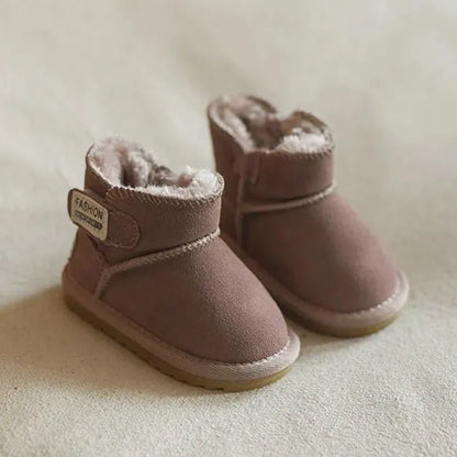Close-up of the zip closure on a brown genuine leather baby snow boot, easy on/off design