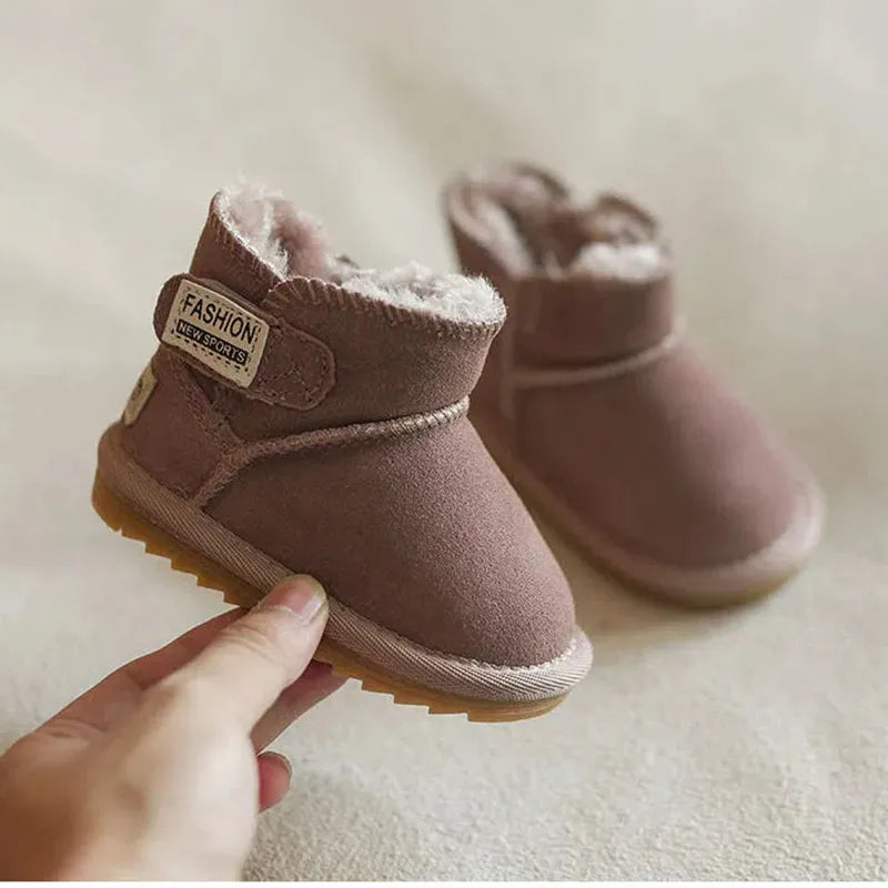 Pair of khaki unisex baby winter boots on a snowy surface, anti-slip sole, perfect for cold weather