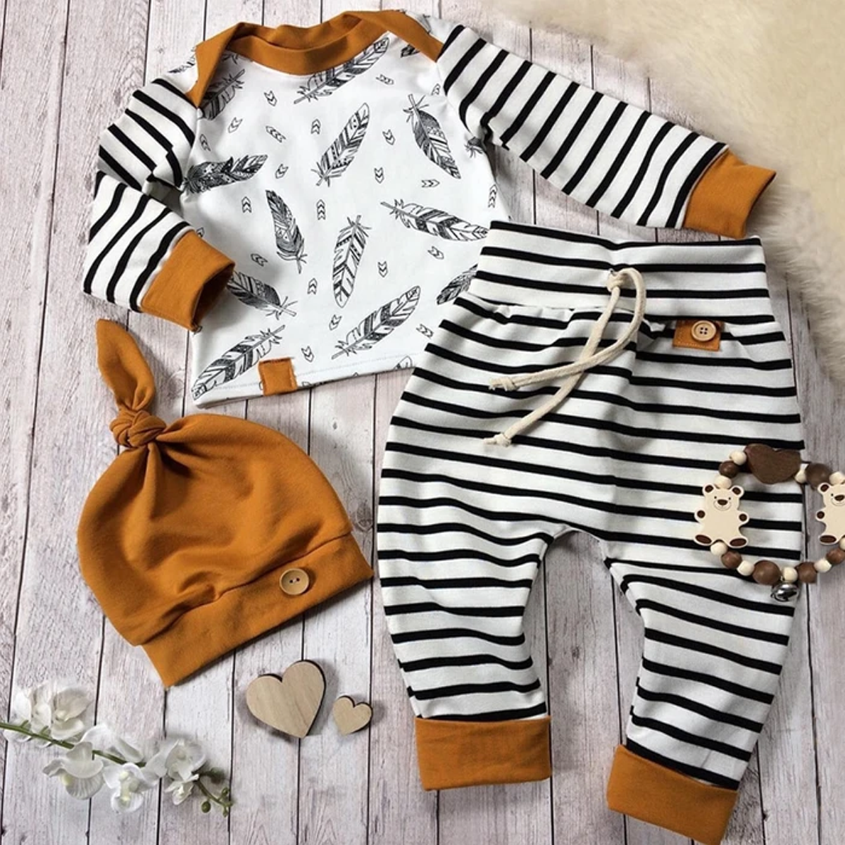 Cute black and white zebra print cotton bodysuit with hat, perfect unisex baby outfit.
