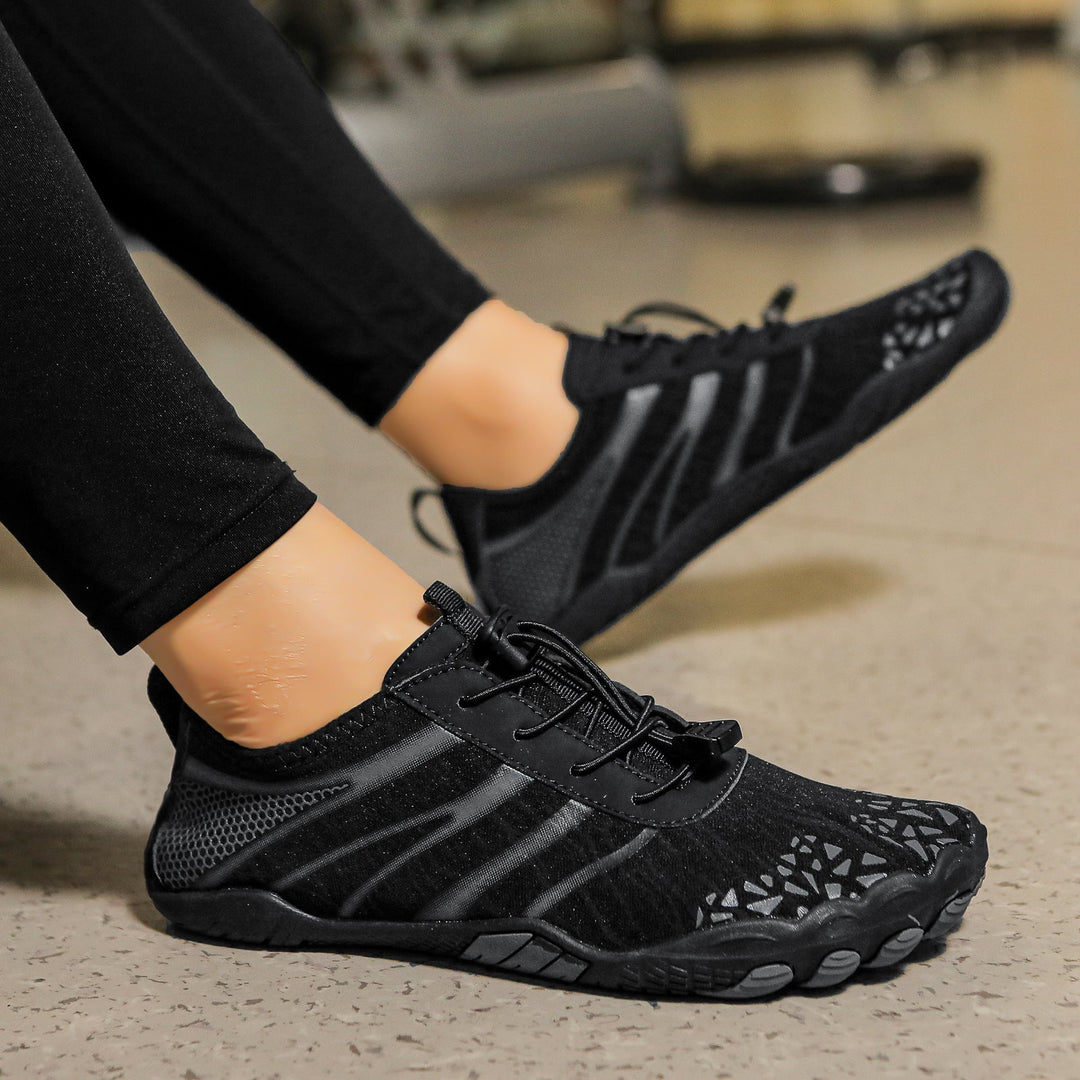 Unisex barefoot shoes, promoting natural movement with a wide toe box & flexible sole design.