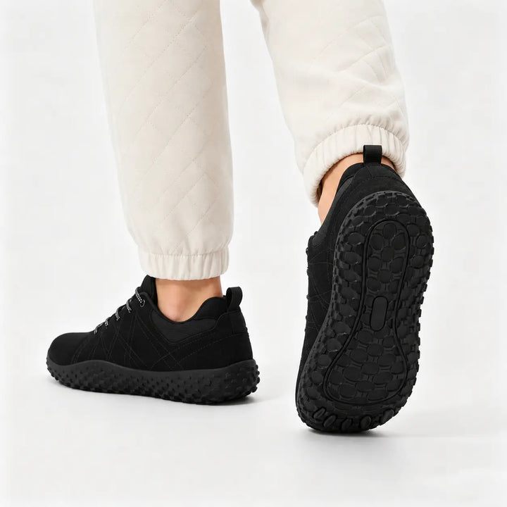 Minimalist trail trainers with a flexible zero-drop design for enhanced outdoor comfort.