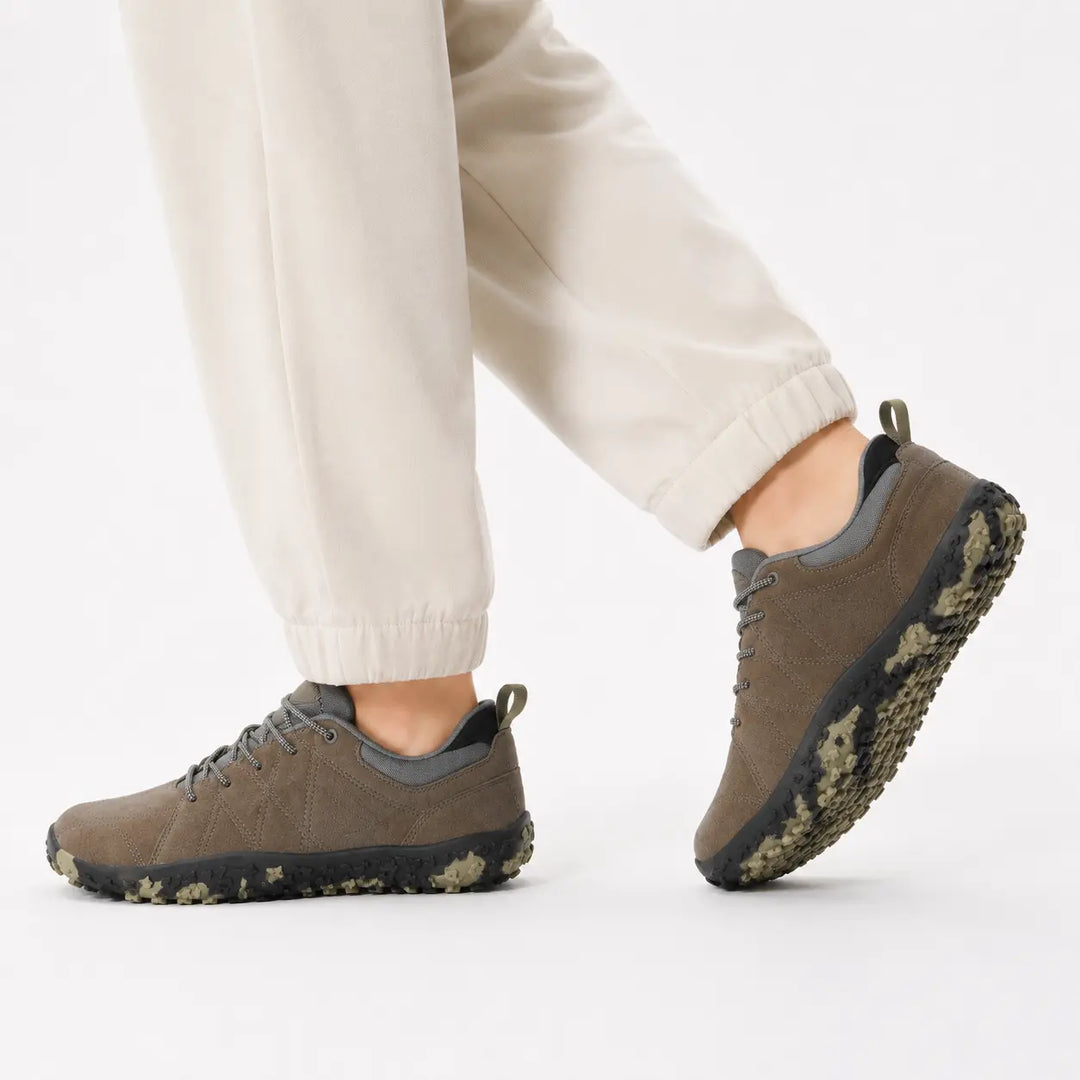 Flexible hiking trainers with wide toe box, promoting a natural barefoot experience on trails.