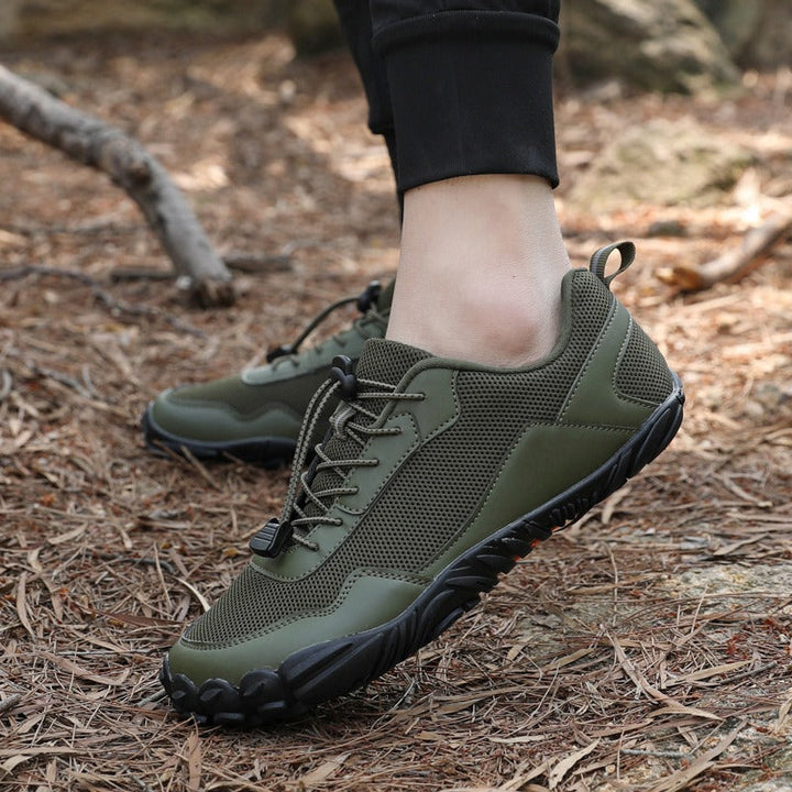 Rugged barefoot trail trainers, wide toe box, non-slip grip, ensuring natural foot comfort on challenging hikes.
