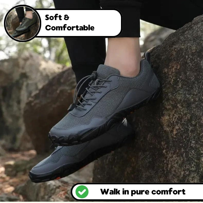 Flexible grey barefoot hiking trainers with wide toe box, offering natural comfort and non-slip grip for trails.