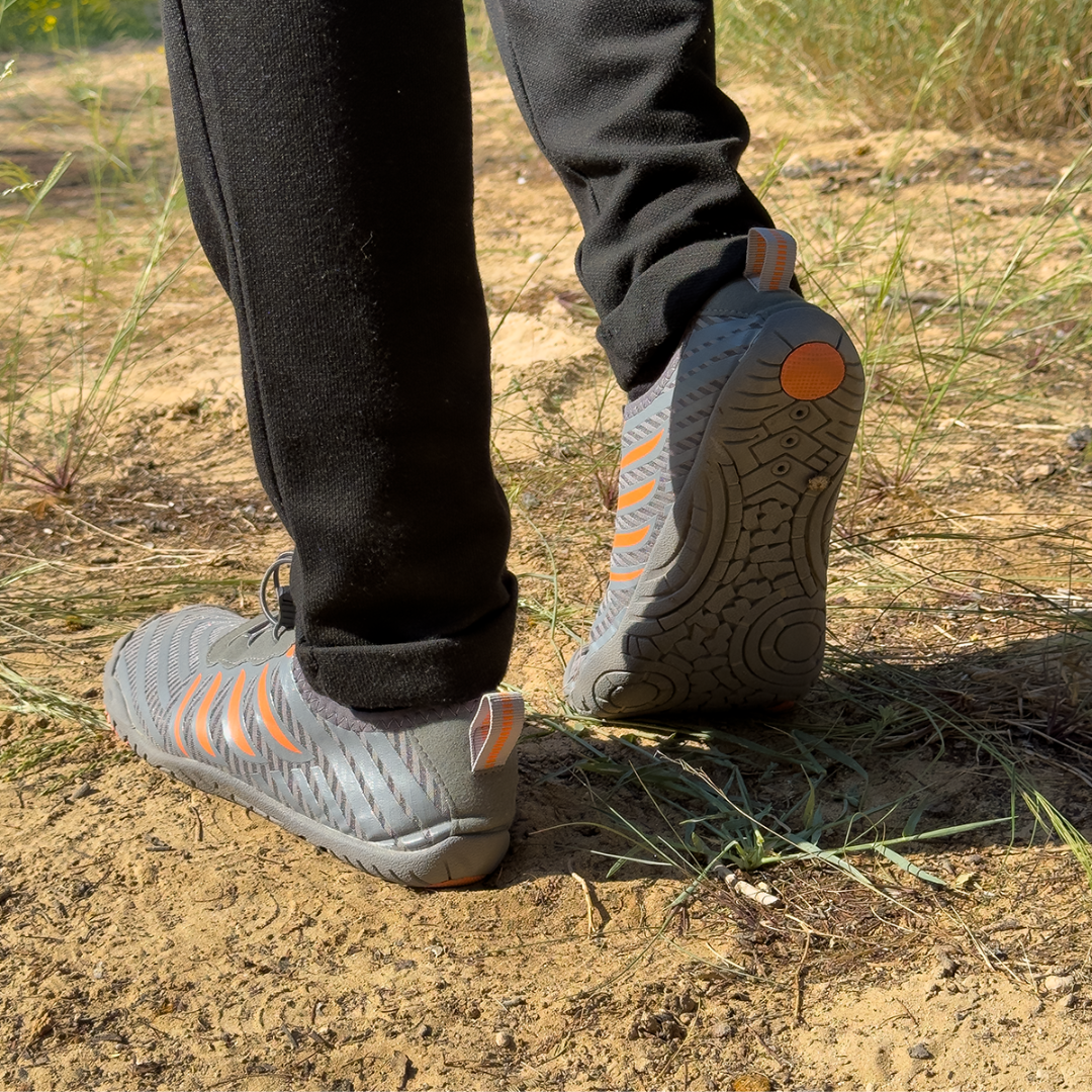 Breathable barefoot shoes for men & women, offering a wide toe box & flexible design for natural feel.