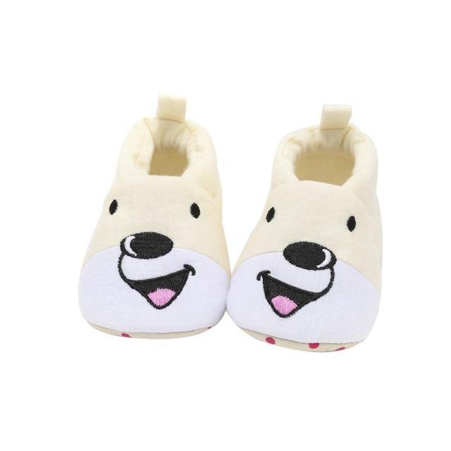 Close-up of a bear cub embroidered on soft sole cotton baby shoes