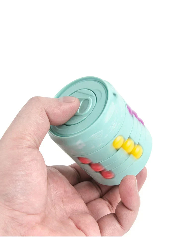 Portable fidget cube activity toy in hand, promoting stress relief and concentration.