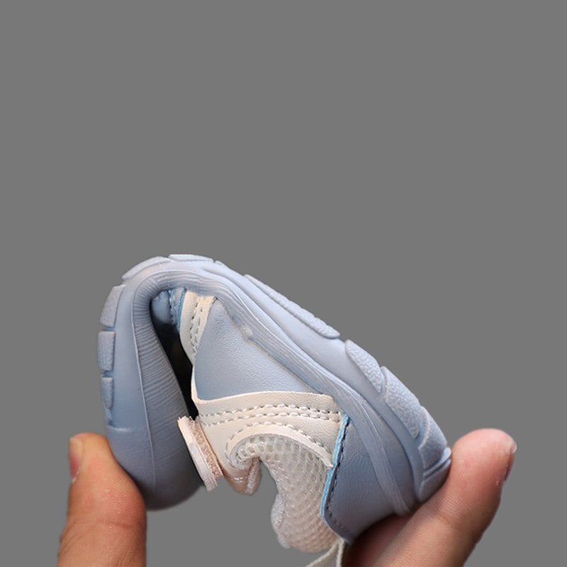 Blue slip-on barefoot baby shoes, ideal for active toddlers learning to walk