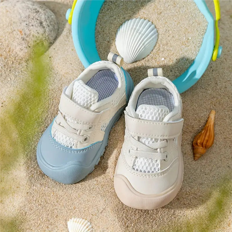 Unisex blue baby shoes, first walker style with a flexible, soft sole