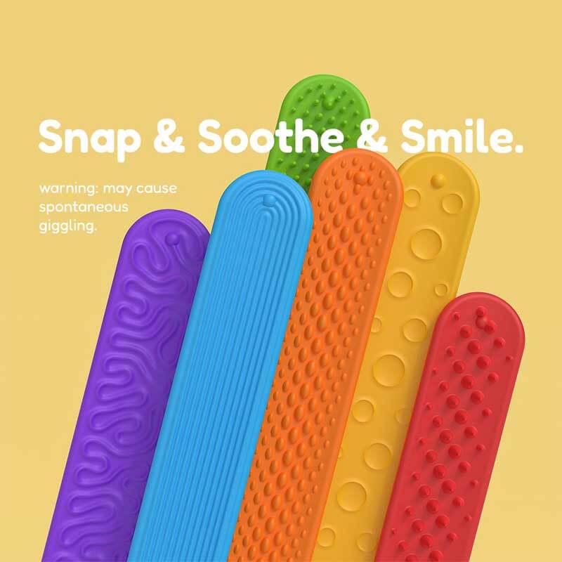 Close-up of a textured red silicone slap bracelet, a sensory fidget toy for tactile stimulation
