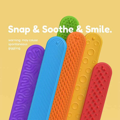 Close-up of a textured red silicone slap bracelet, a sensory fidget toy for tactile stimulation