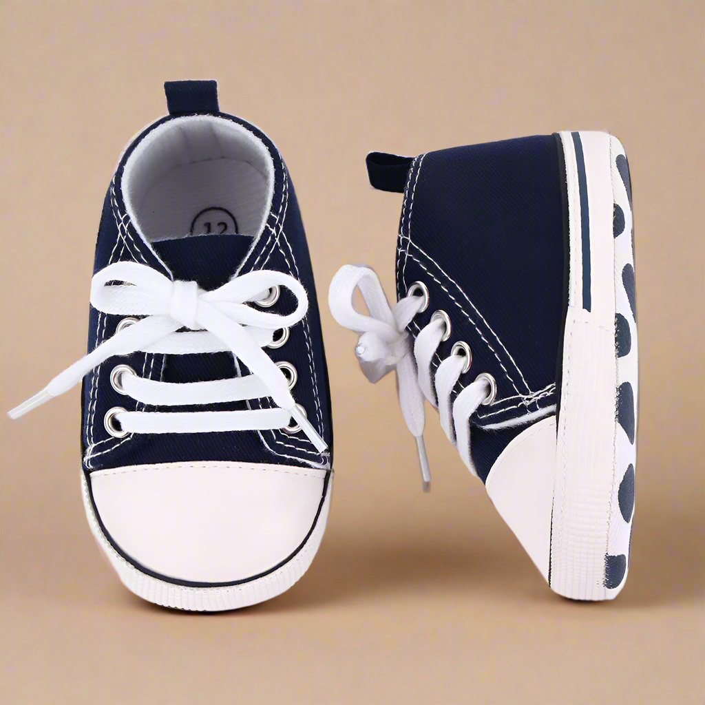 Close-up of breathable mesh on first walker baby sneakers, flexible sole