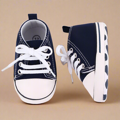 Close-up of breathable mesh on first walker baby sneakers, flexible sole