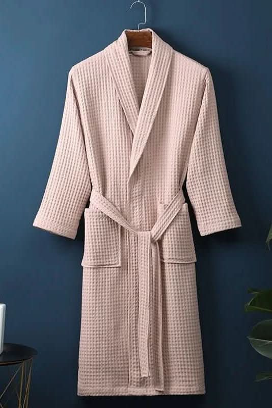Close-up of soft, breathable waffle weave fabric on a luxurious unisex spa robe.