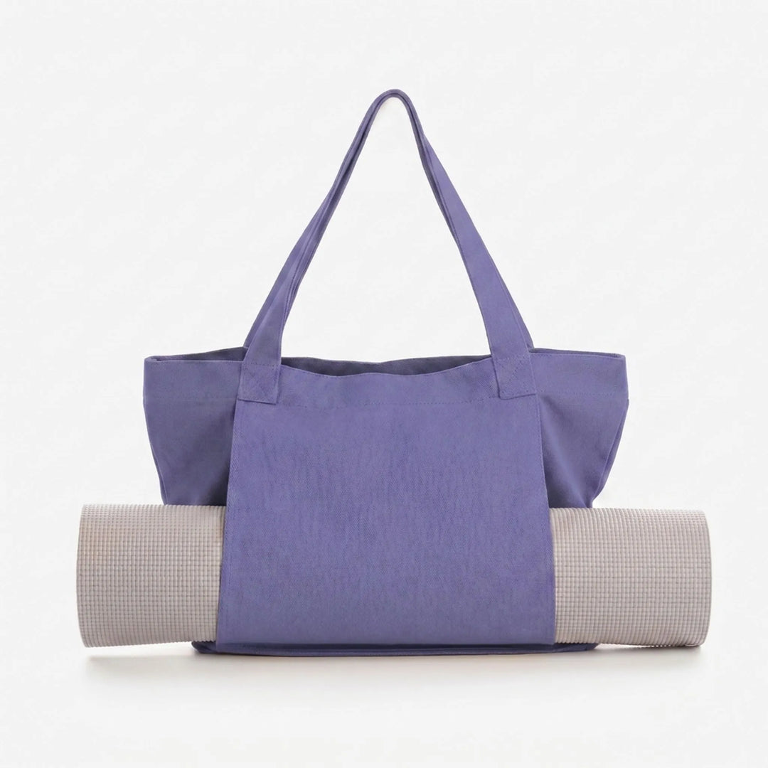 Spacious yoga mat carrier tote bag featuring extra pockets for gym essentials, hands-free design.