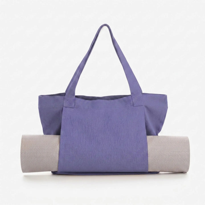 Spacious yoga mat carrier tote bag featuring extra pockets for gym essentials, hands-free design.