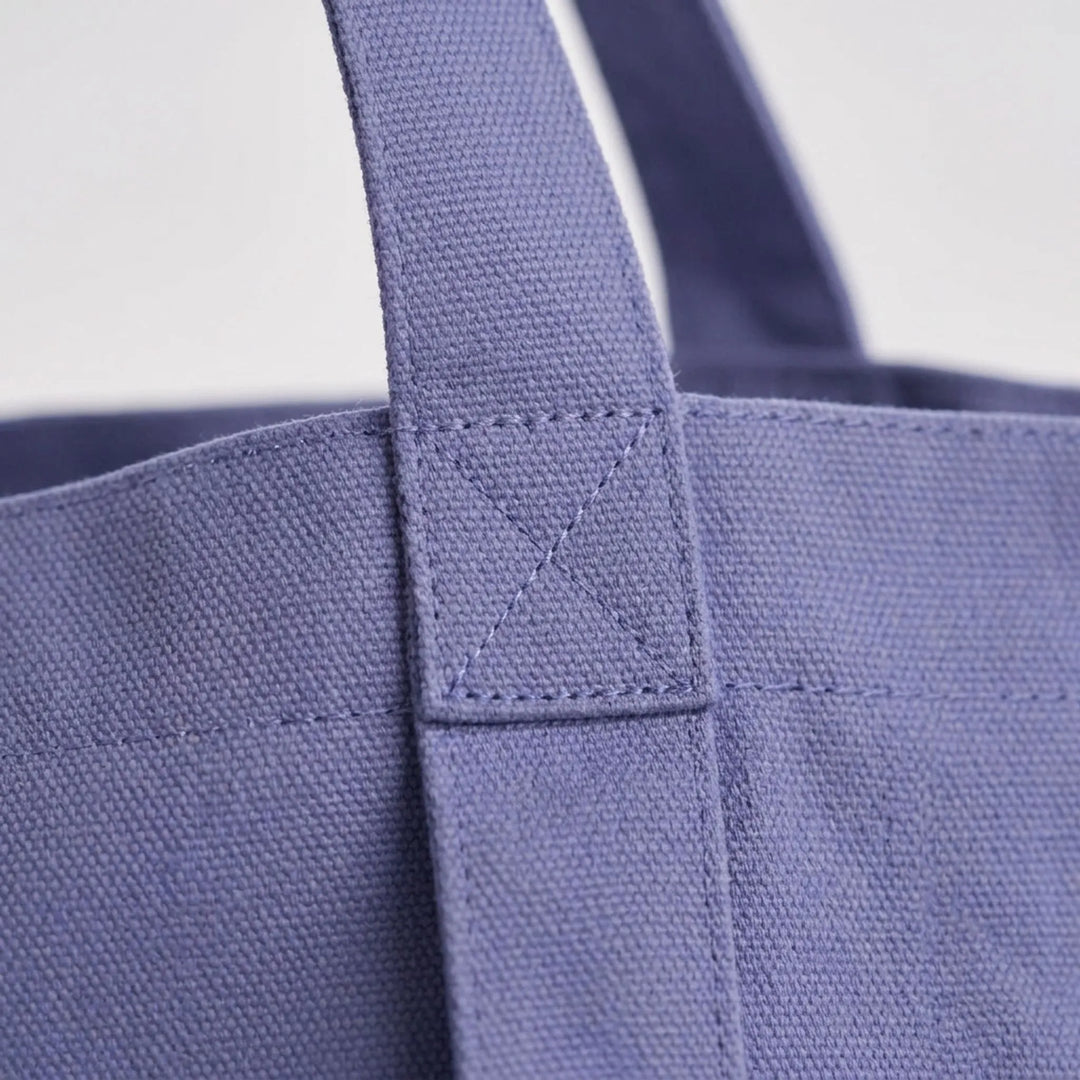 Durable canvas yoga mat shoulder bag, stylish & practical for studio, gym, or daily activewear.